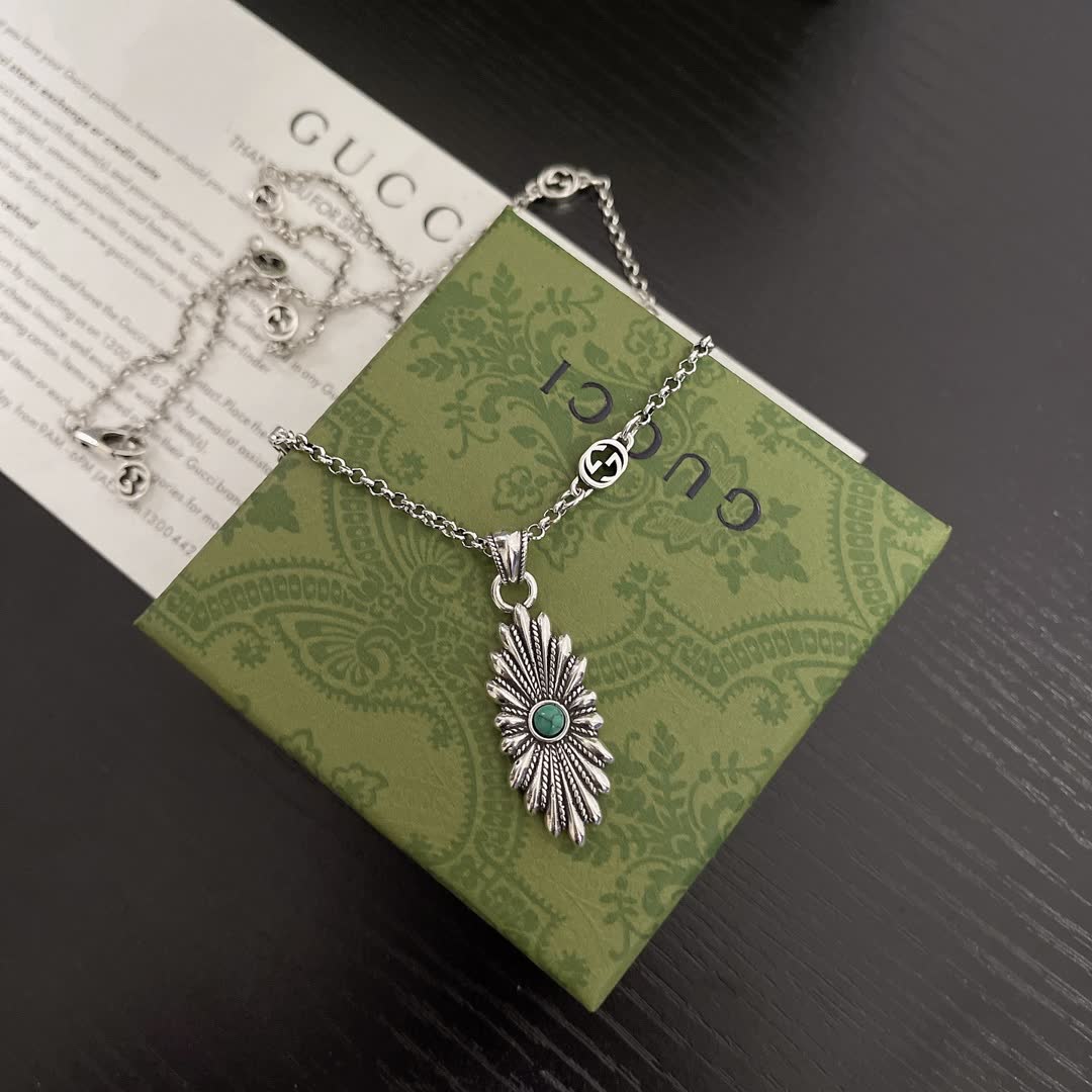 Gucci Silver Starburst Pendant Necklace with Green Stone