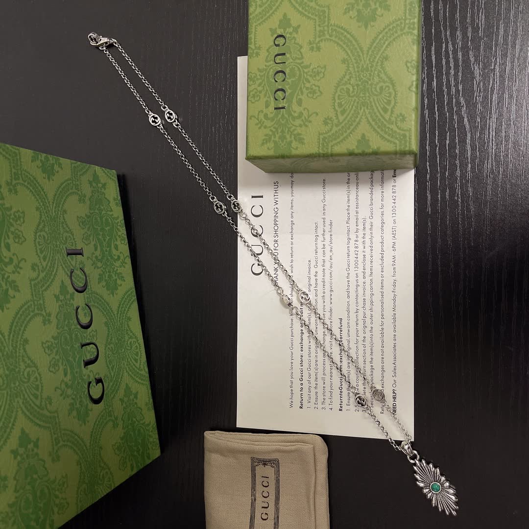 Gucci Silver Starburst Pendant Necklace with Green Stone