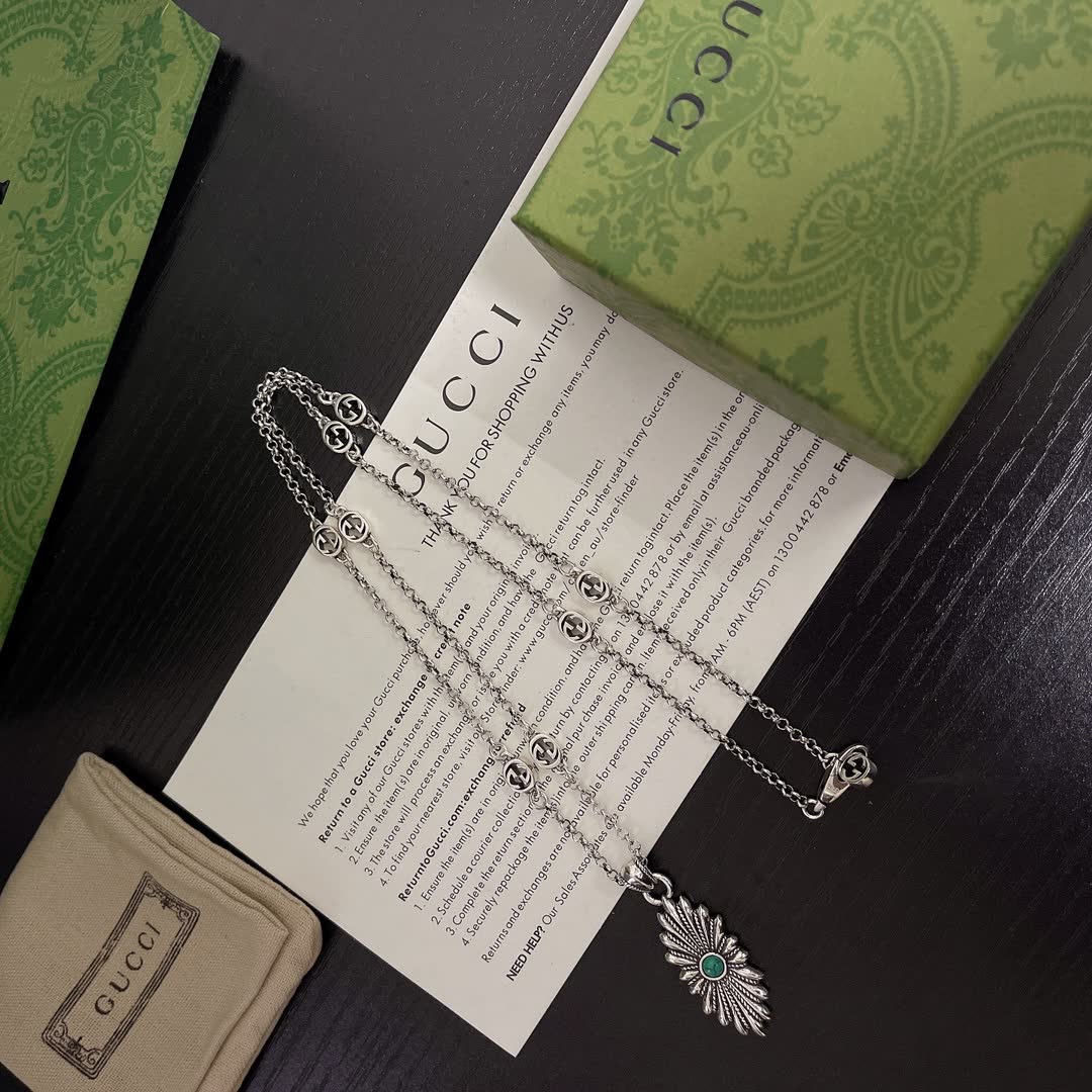 Gucci Silver Starburst Pendant Necklace with Green Stone