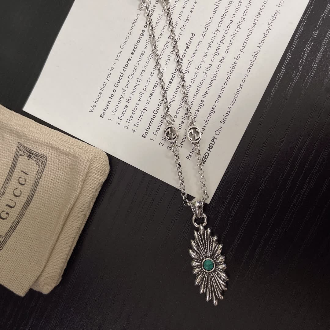 Gucci Silver Starburst Pendant Necklace with Green Stone