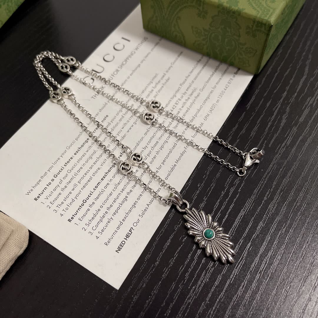 Gucci Silver Starburst Pendant Necklace with Green Stone