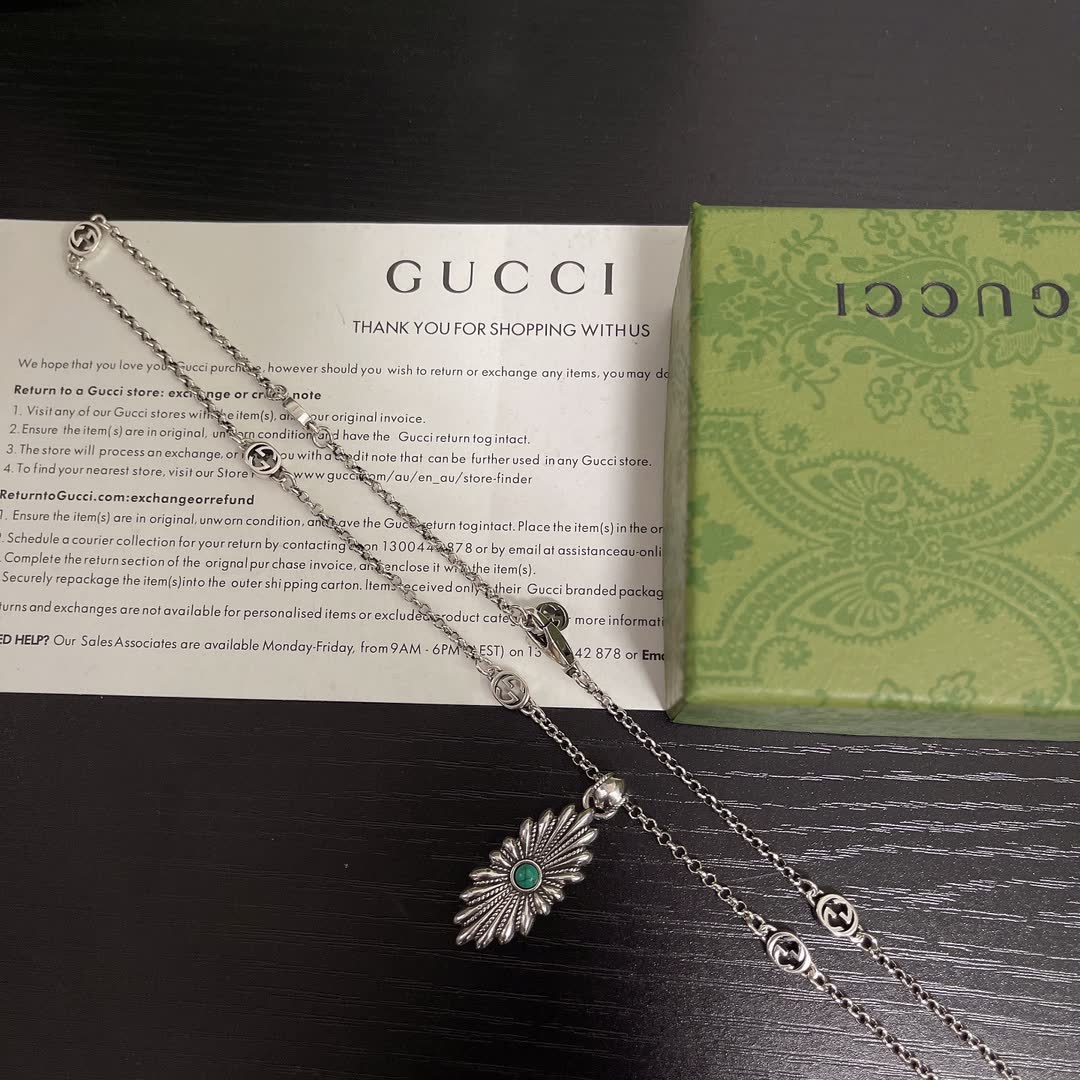 Gucci Silver Starburst Pendant Necklace with Green Stone