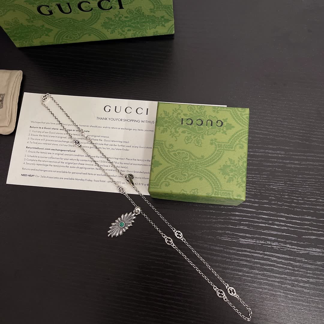 Gucci Silver Starburst Pendant Necklace with Green Stone