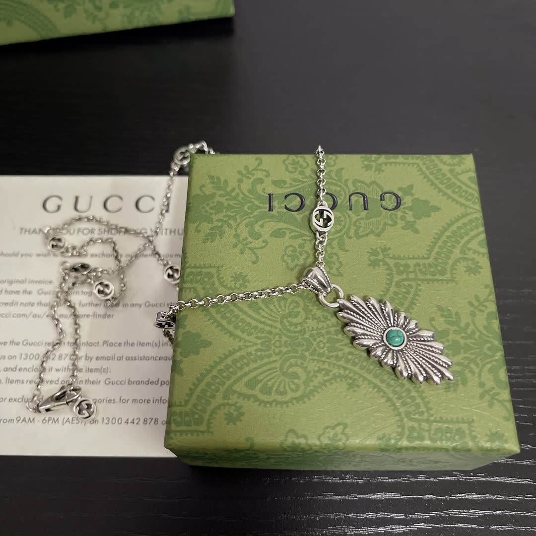 Gucci Silver Starburst Pendant Necklace with Green Stone