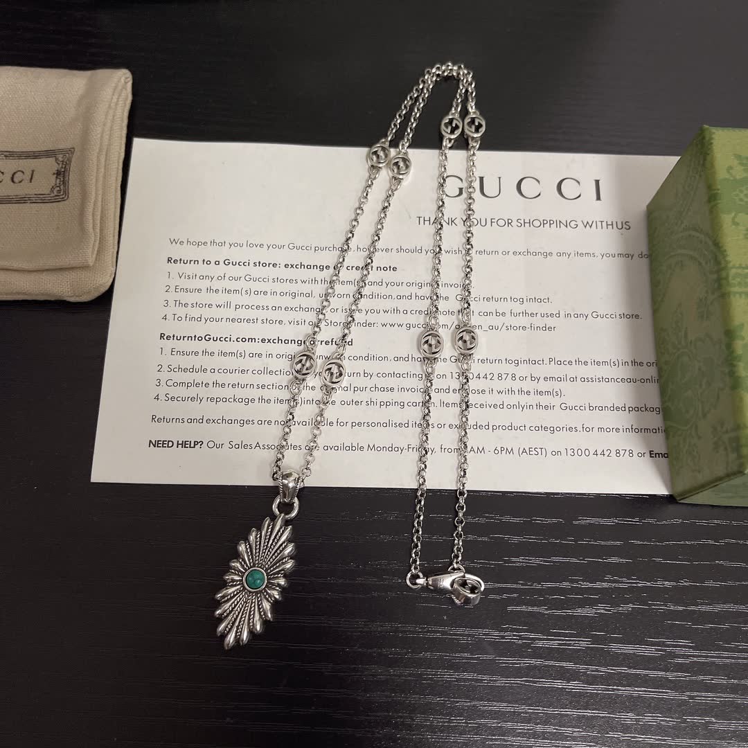 Gucci Silver Starburst Pendant Necklace with Green Stone