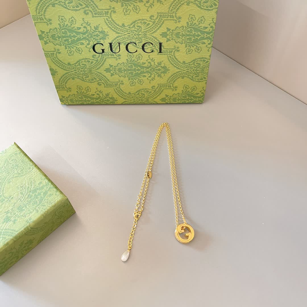 Gucci Gold Tone G Logo and Pearl Pendant Necklace