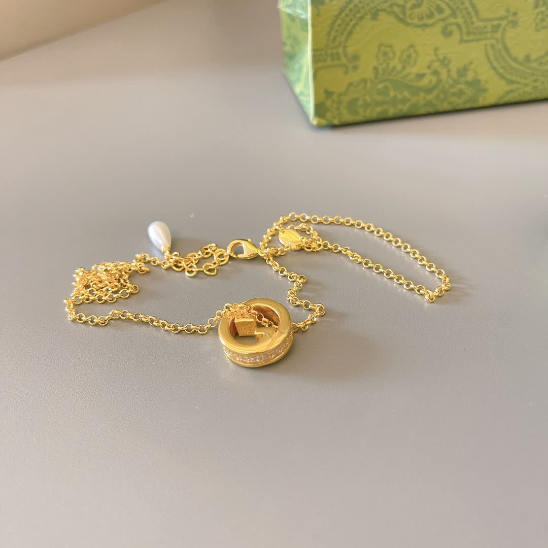 Gucci Gold Tone G Logo and Pearl Pendant Necklace