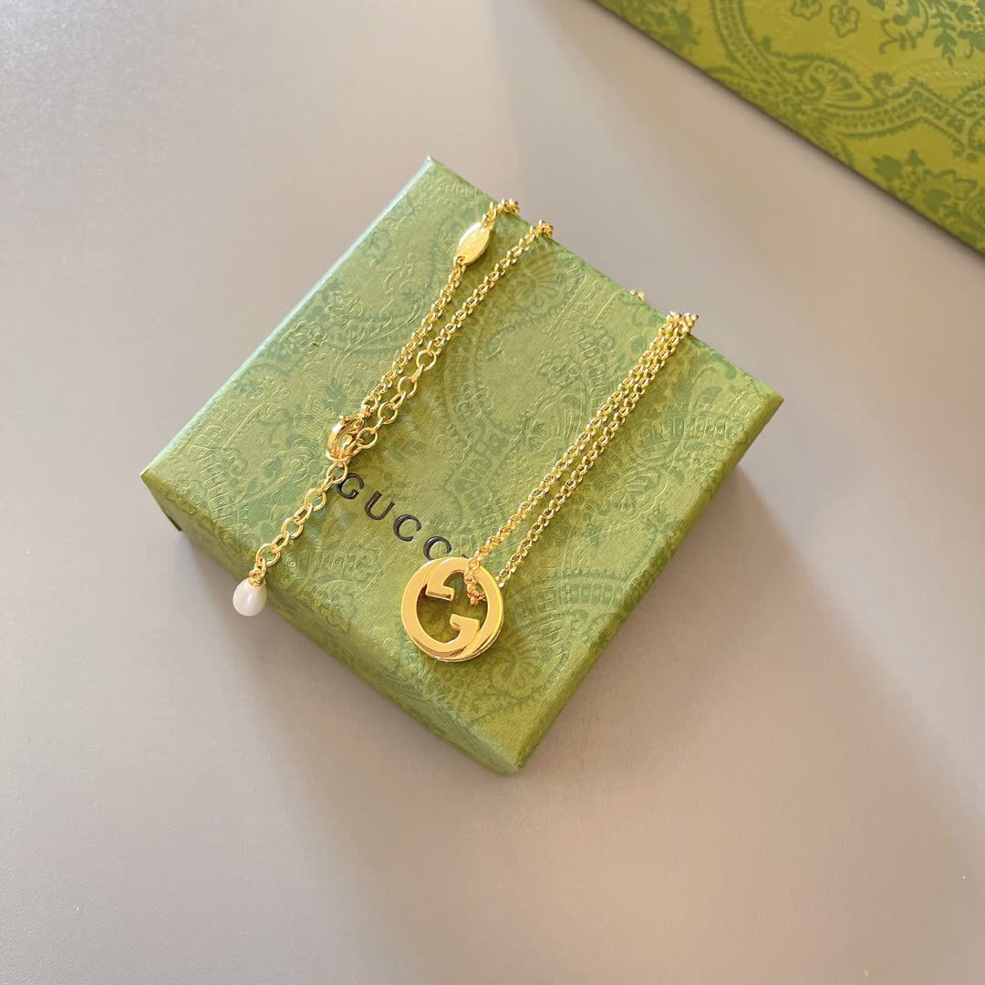 Gucci Gold Tone G Logo and Pearl Pendant Necklace