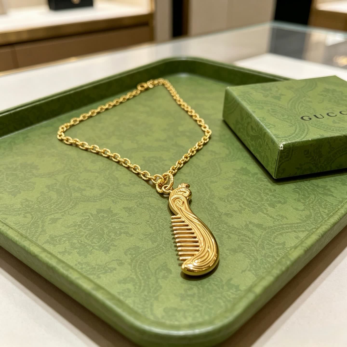 Gucci Gold Tone Comb Pendant Necklace