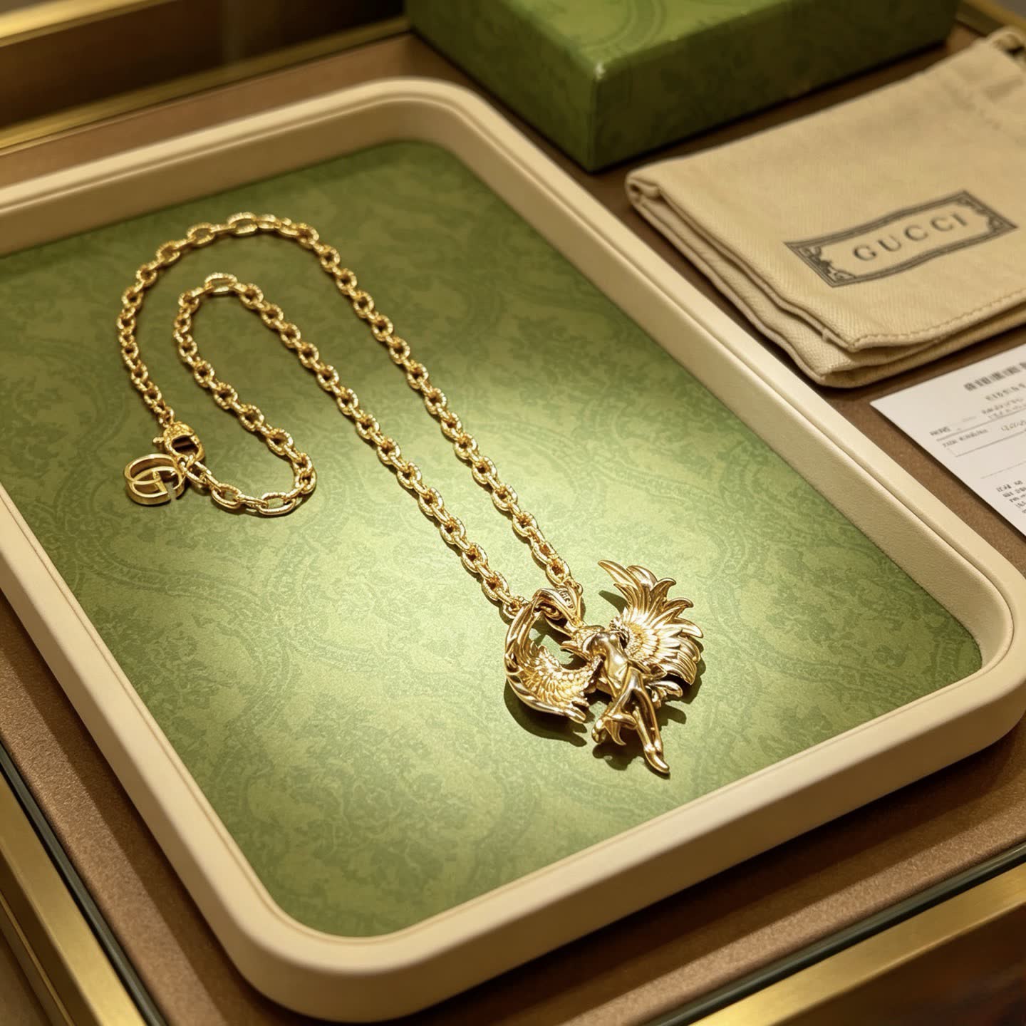 Gucci Gold Winged Figure Pendant Necklace Gucci Gold Winged Figure Pendant Necklace