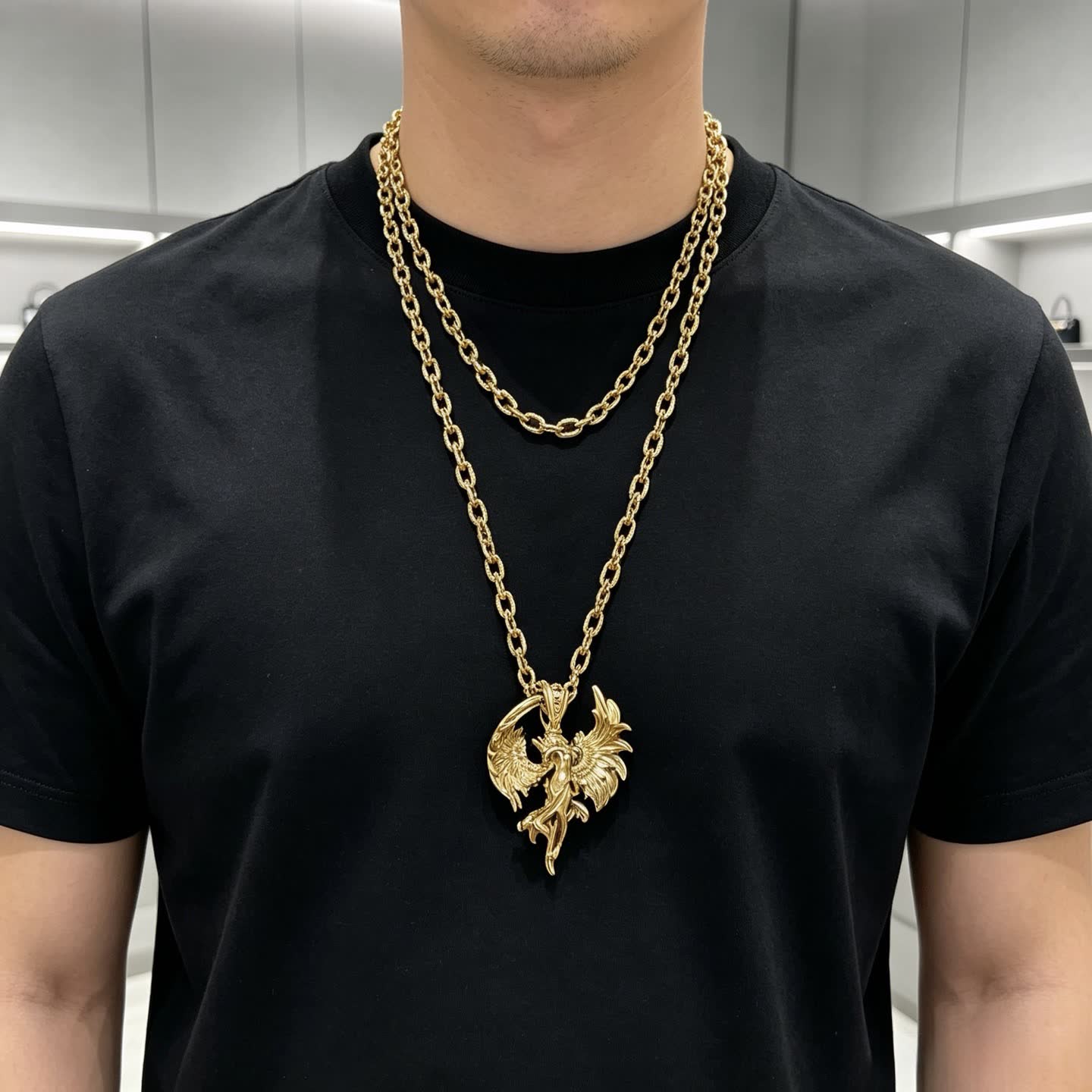 Gucci Gold Winged Figure Pendant Necklace