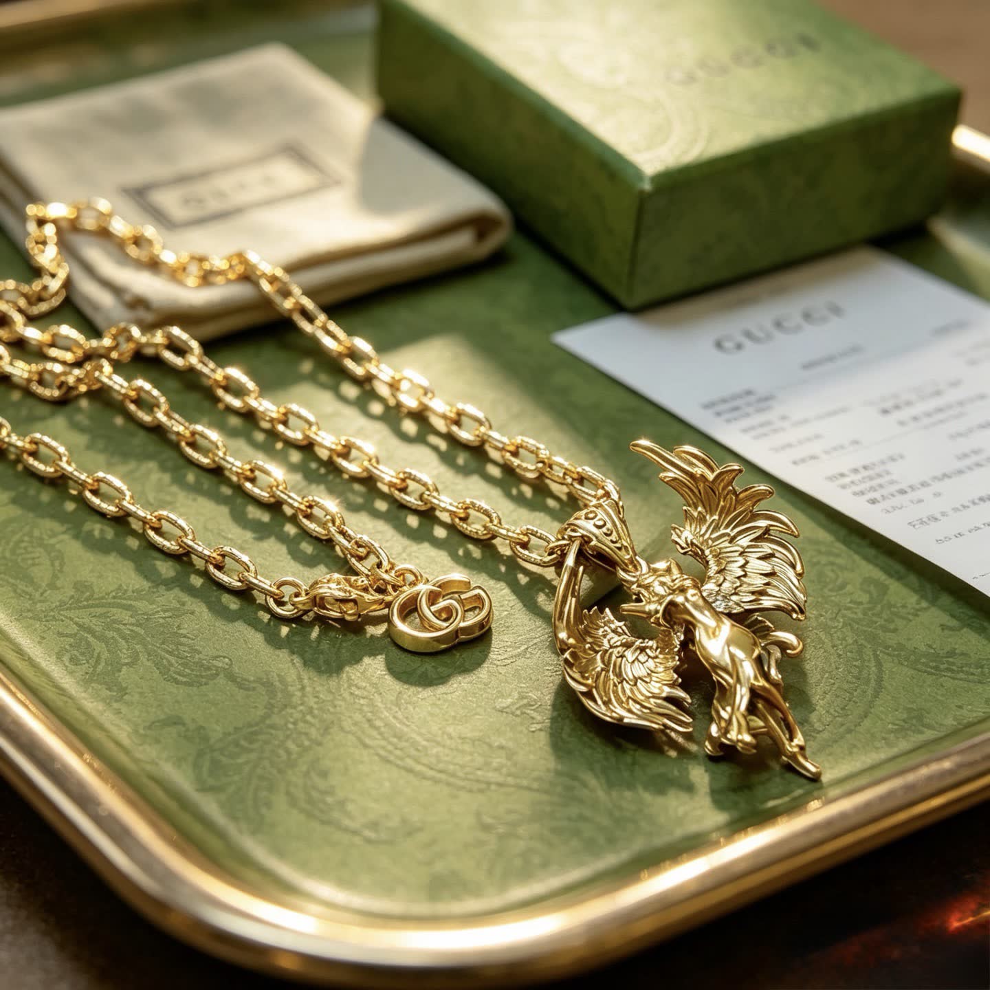Gucci Gold Winged Figure Pendant Necklace