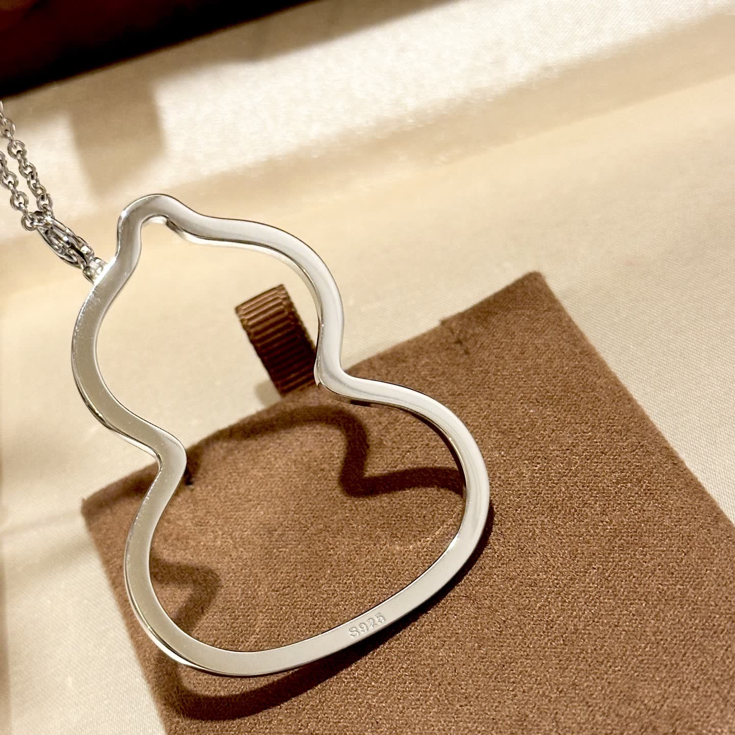 Qeelin Q Brand Silver Rhinestone Curved Pendant Necklace