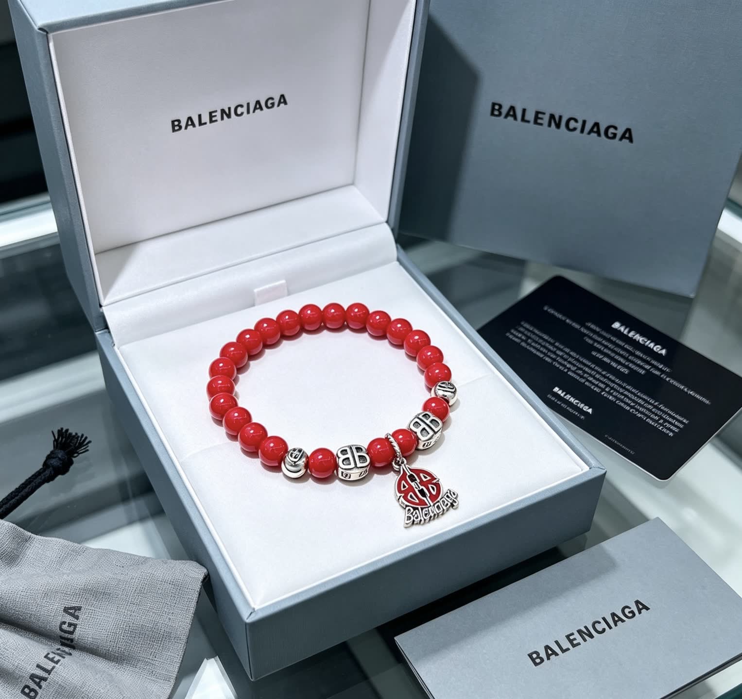 Balenciaga Red Beaded Bracelet with Logo Charm Balenciaga Red Beaded Bracelet with Logo Charm