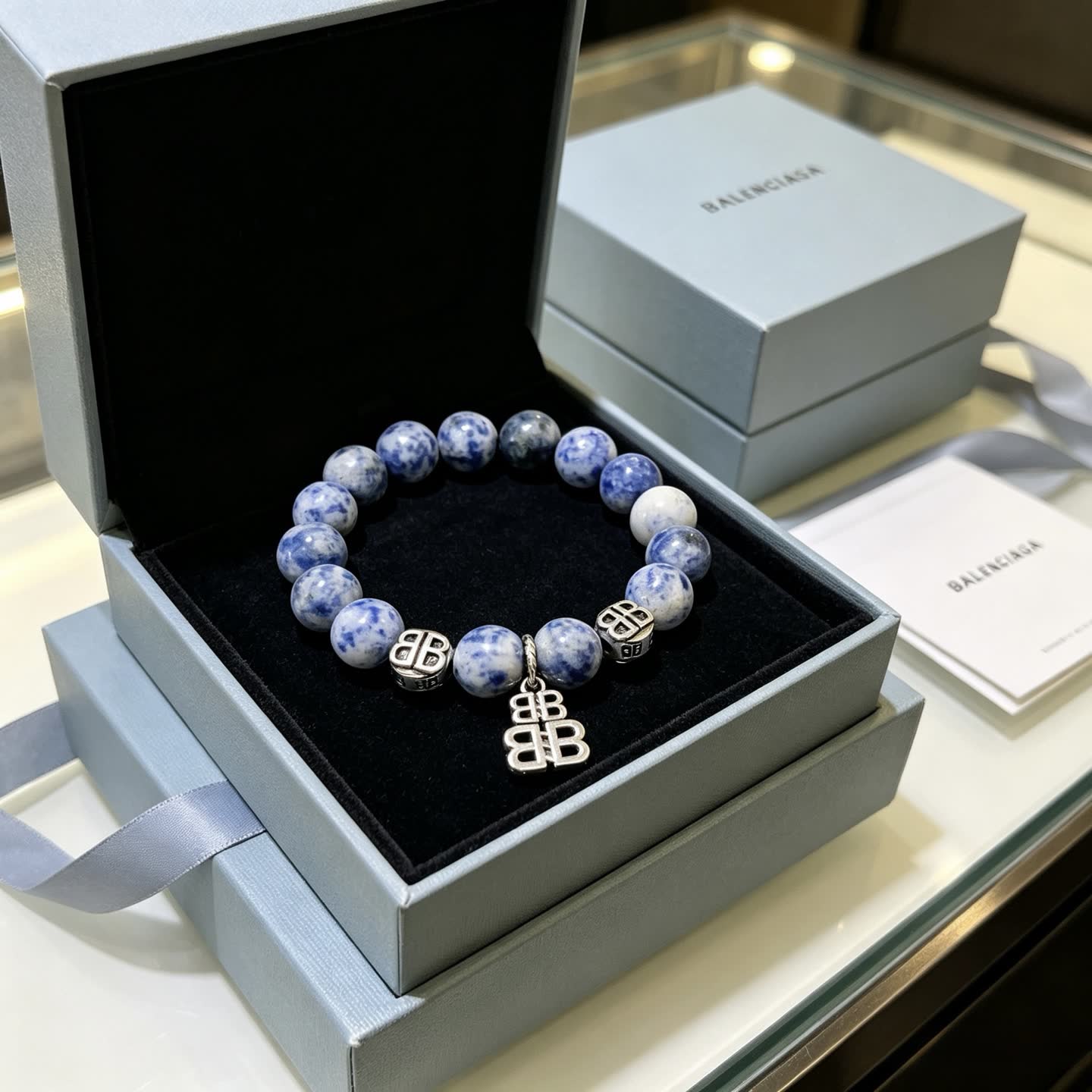 Balenciaga Blue Beaded Bracelet with Logo Charms Balenciaga Blue Beaded Bracelet with Logo Charms