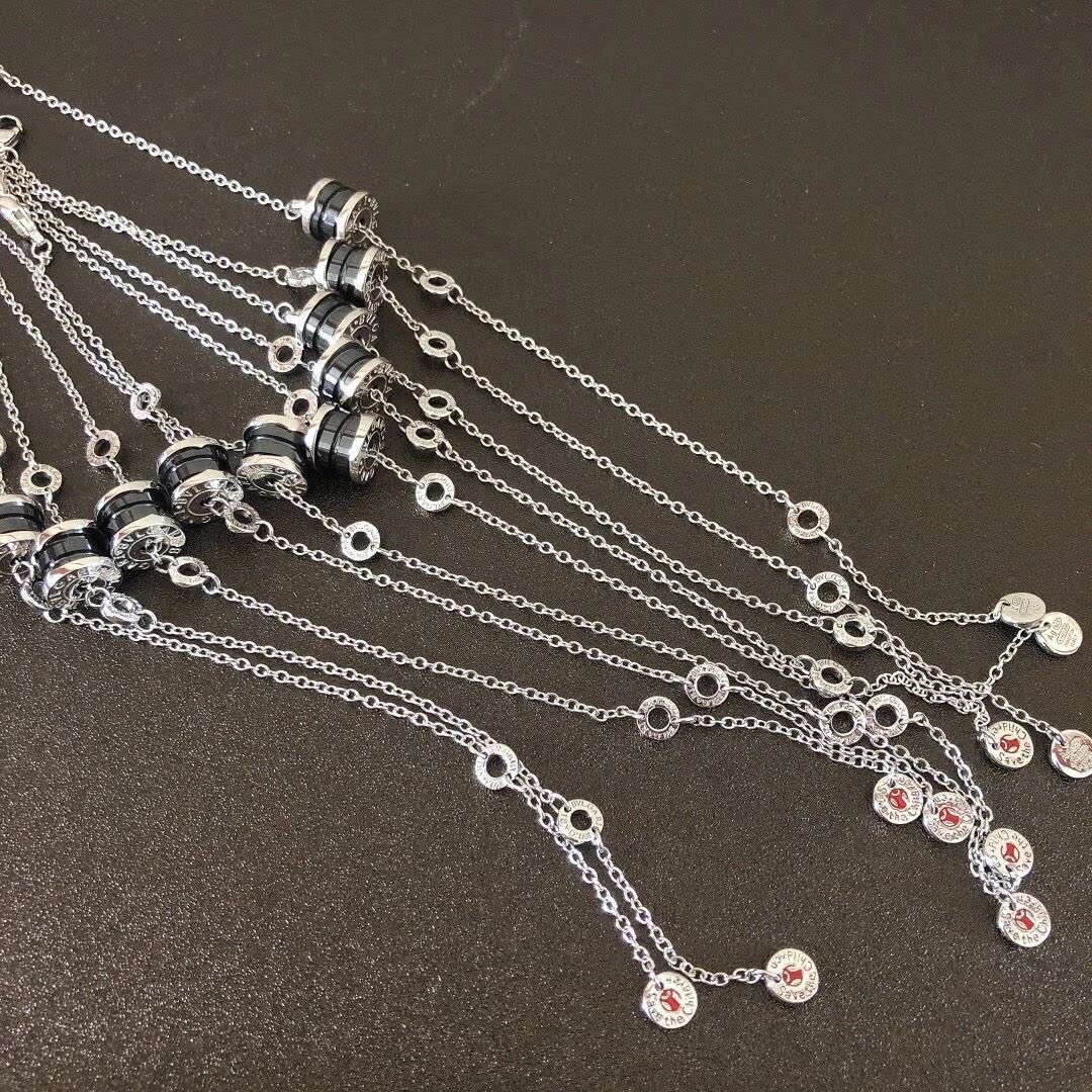 Bvlgari Silver Charm Bracelet with Red and Black Stones