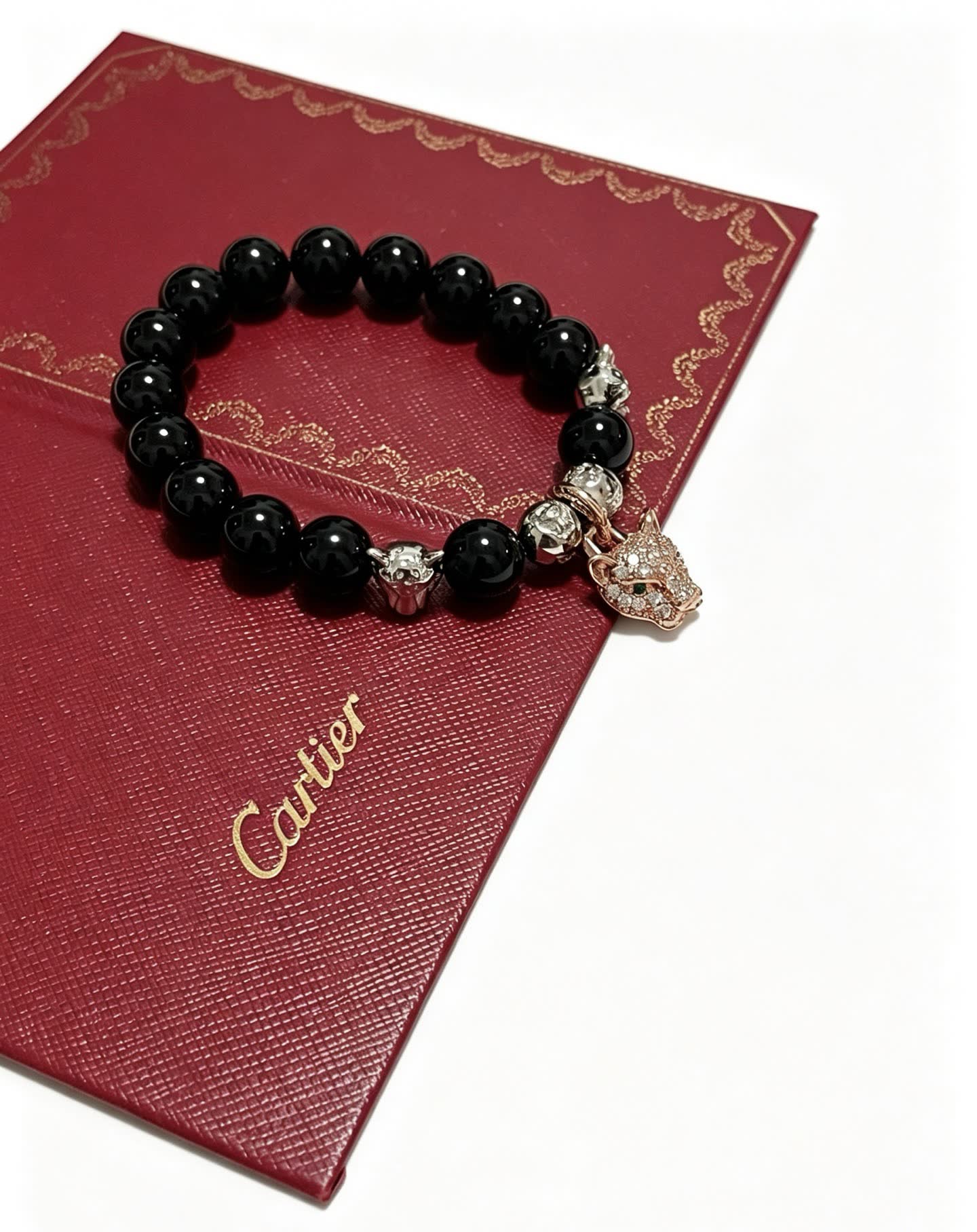 Cartier Black Onyx and Diamond Panthere Charm Bracelet Cartier Black Onyx and Diamond Panthere Charm Bracelet
