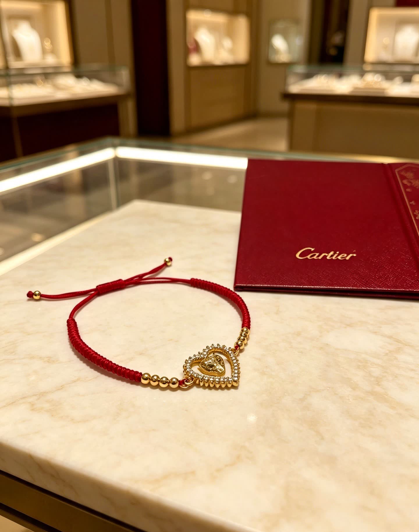 Cartier Red Rope Bracelet with Gold Heart and Animal Charm