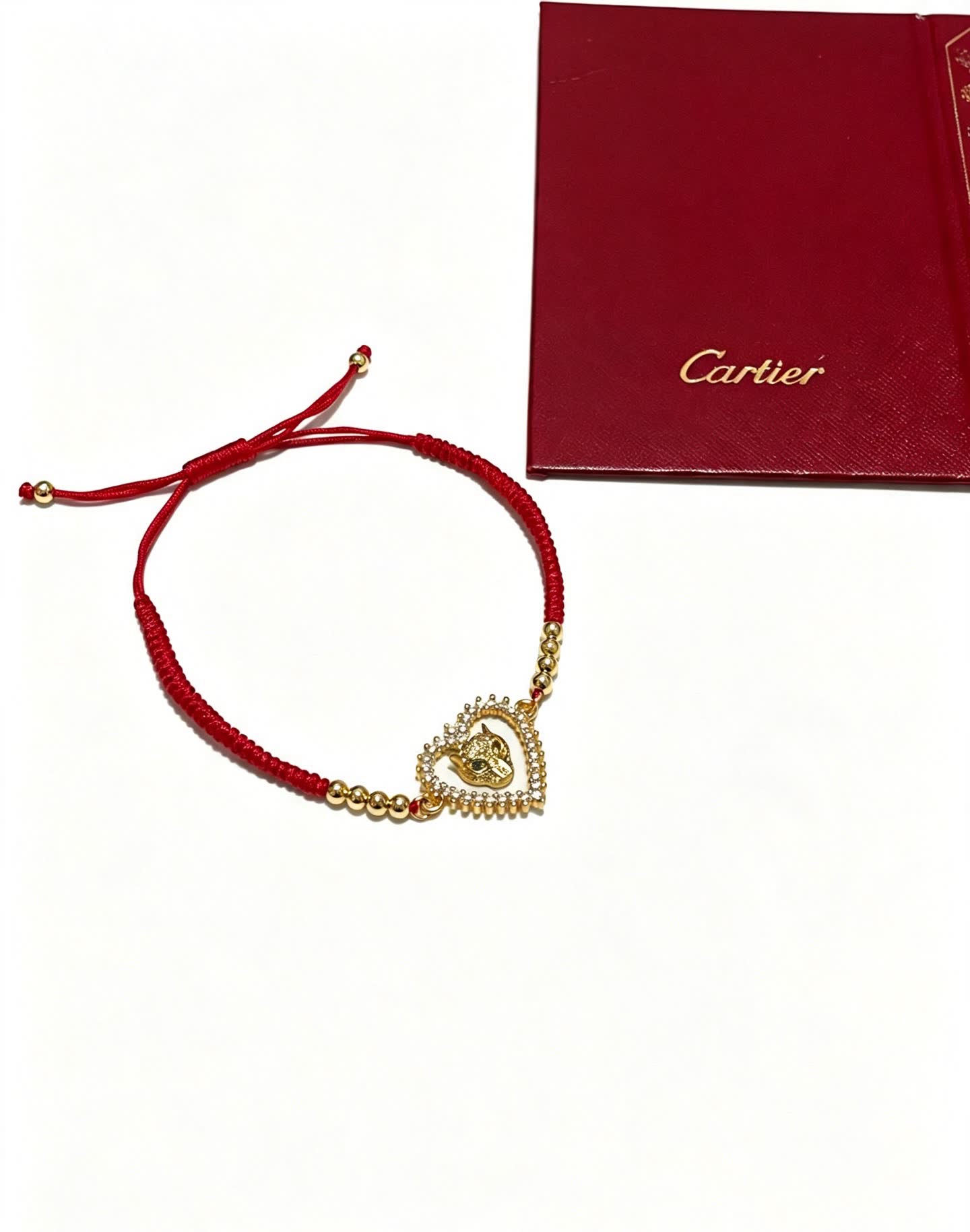 Cartier Red Rope Bracelet with Gold Heart and Animal Charm