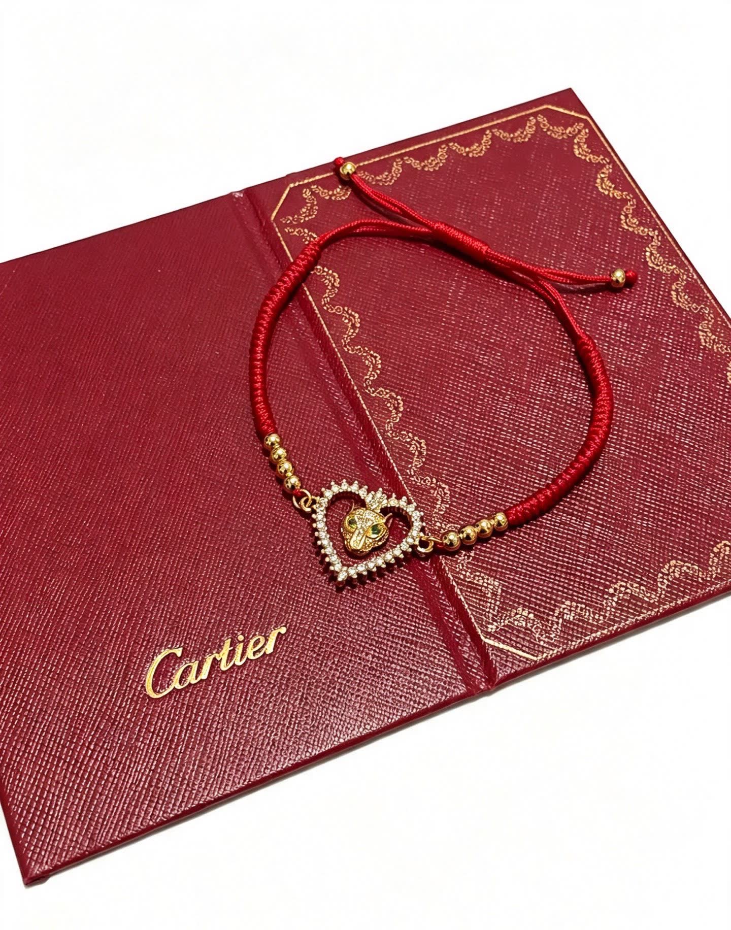 Cartier Red Rope Bracelet with Gold Heart and Animal Charm