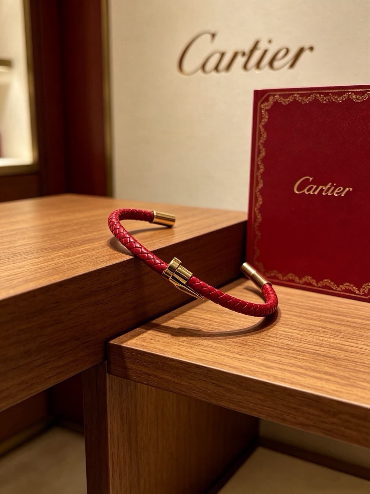 Cartier Red Braided Leather Bracelet with Gold Clasp