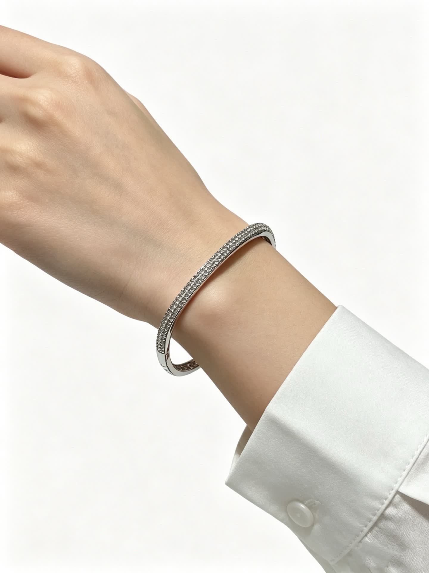 Cartier Elegant Silver Bangle Bracelet with Pave Setting
