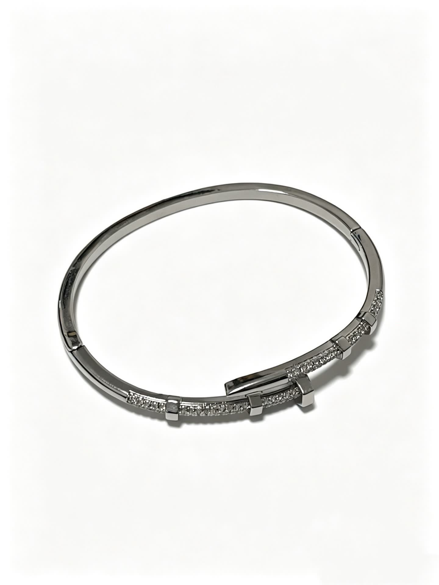Cartier Elegant Silver Bangle Bracelet with Diamond Accents Cartier Elegant Silver Bangle Bracelet with Diamond Accents
