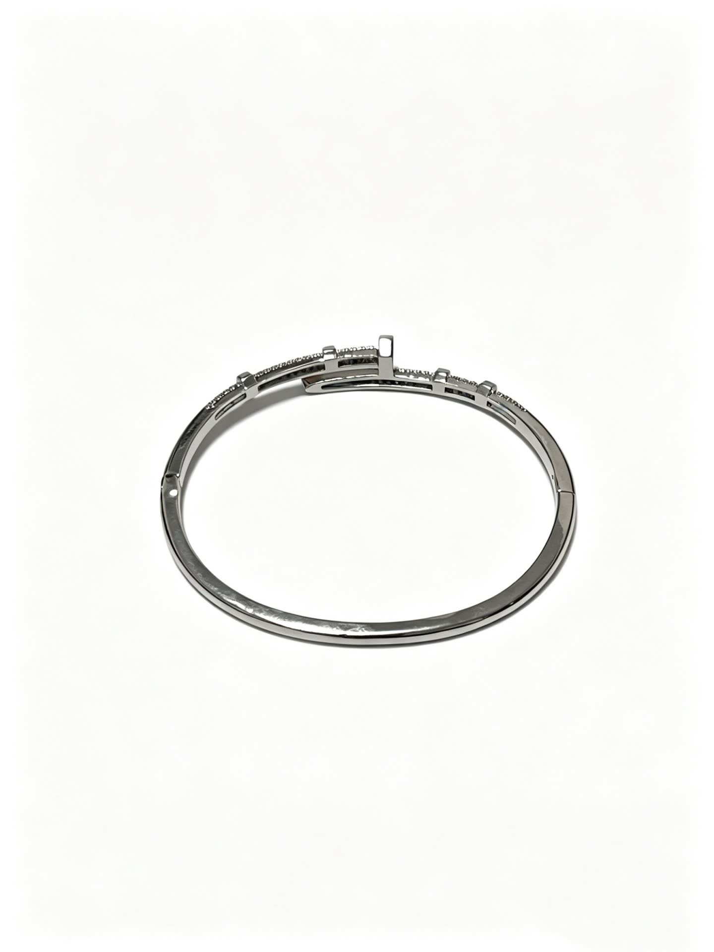 Cartier Elegant Silver Bangle Bracelet with Diamond Accents
