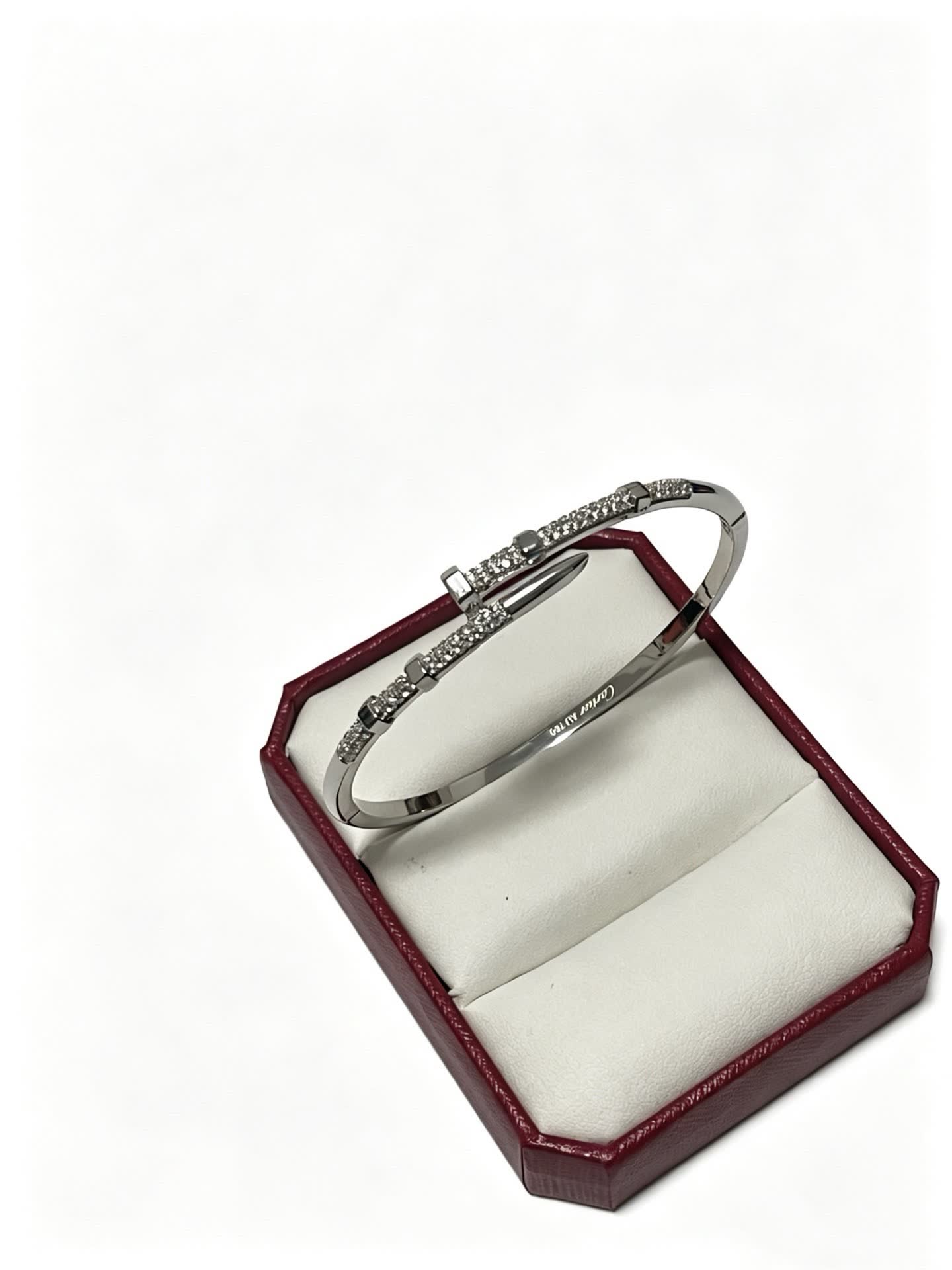 Cartier Elegant Silver Bangle Bracelet with Diamond Accents