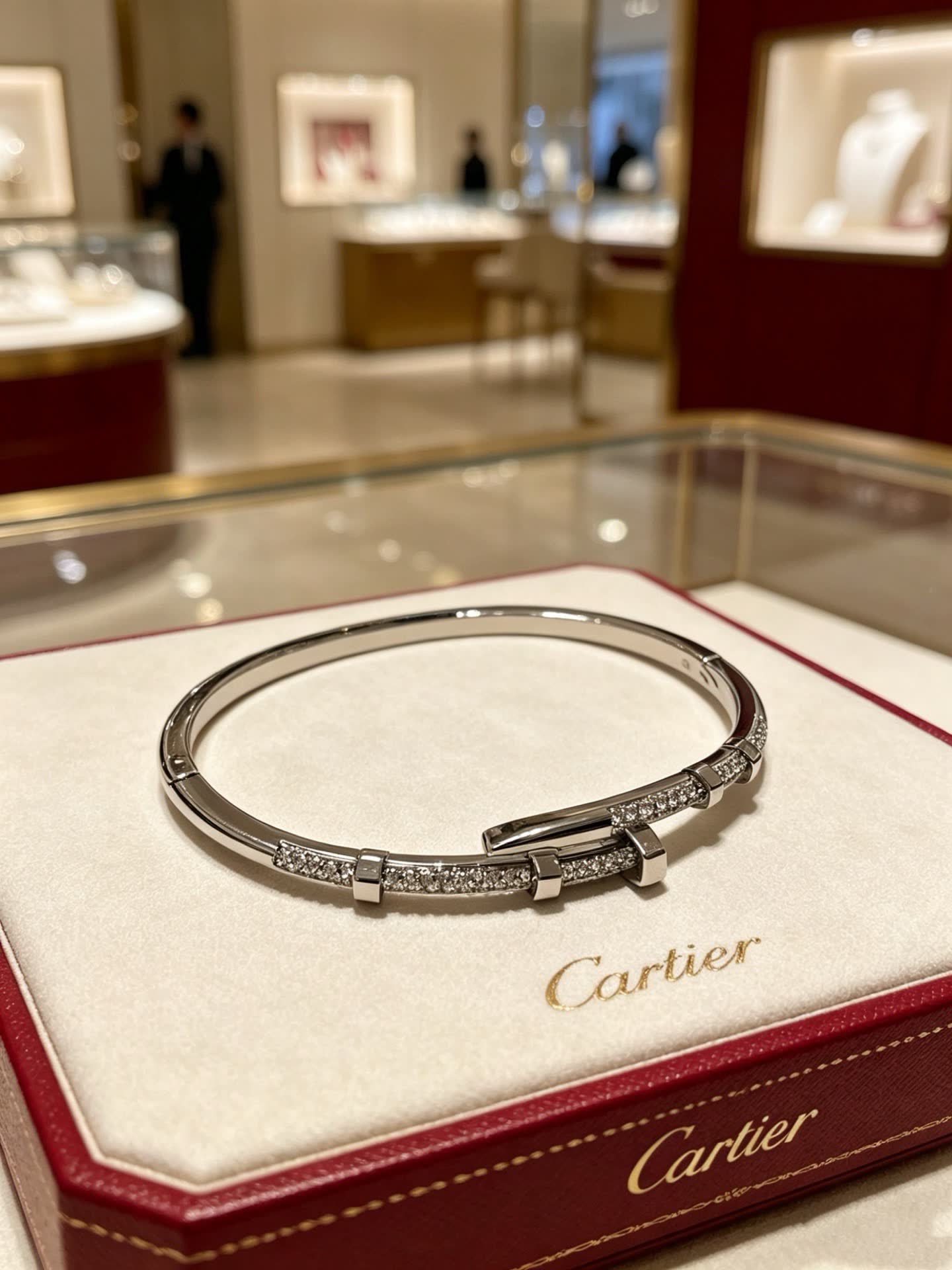 Cartier Elegant Silver Bangle Bracelet with Diamond Accents