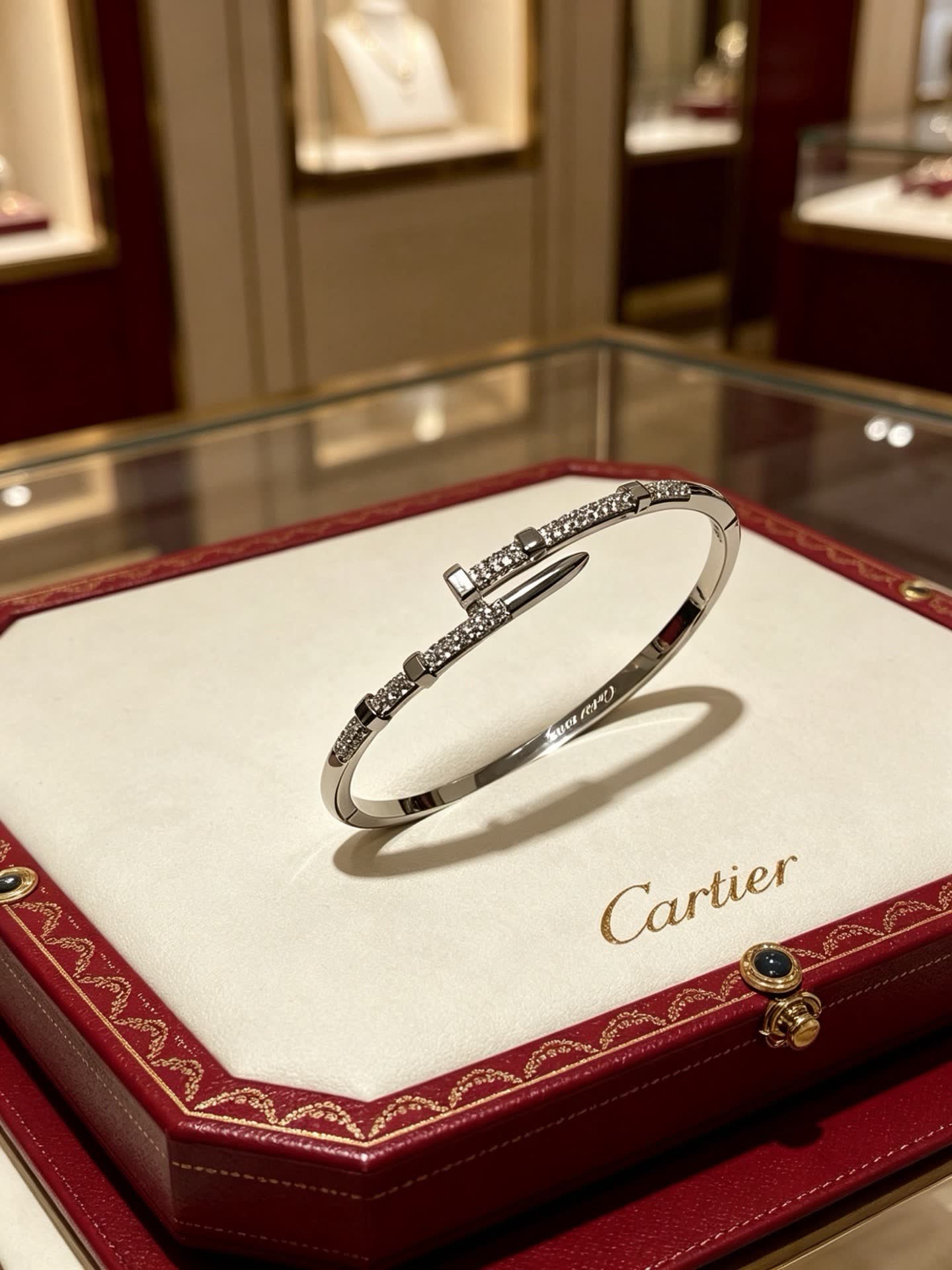 Cartier Elegant Silver Bangle Bracelet with Diamond Accents