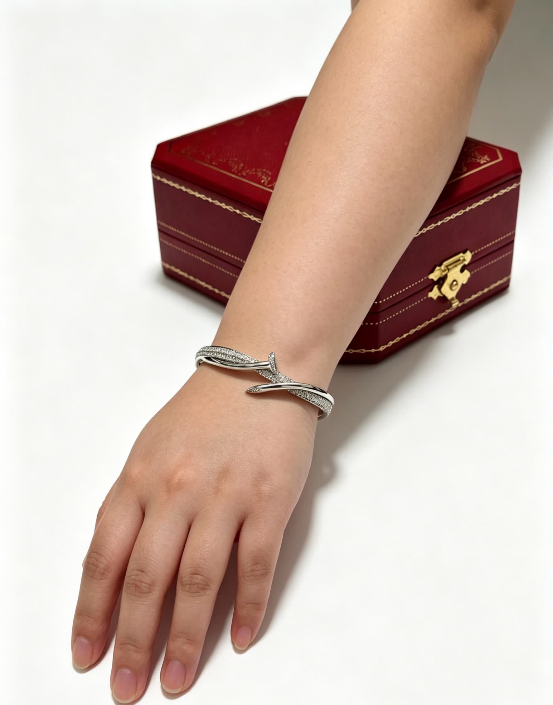 Cartier Elegant Silver Bangle Bracelet with Diamond Accents