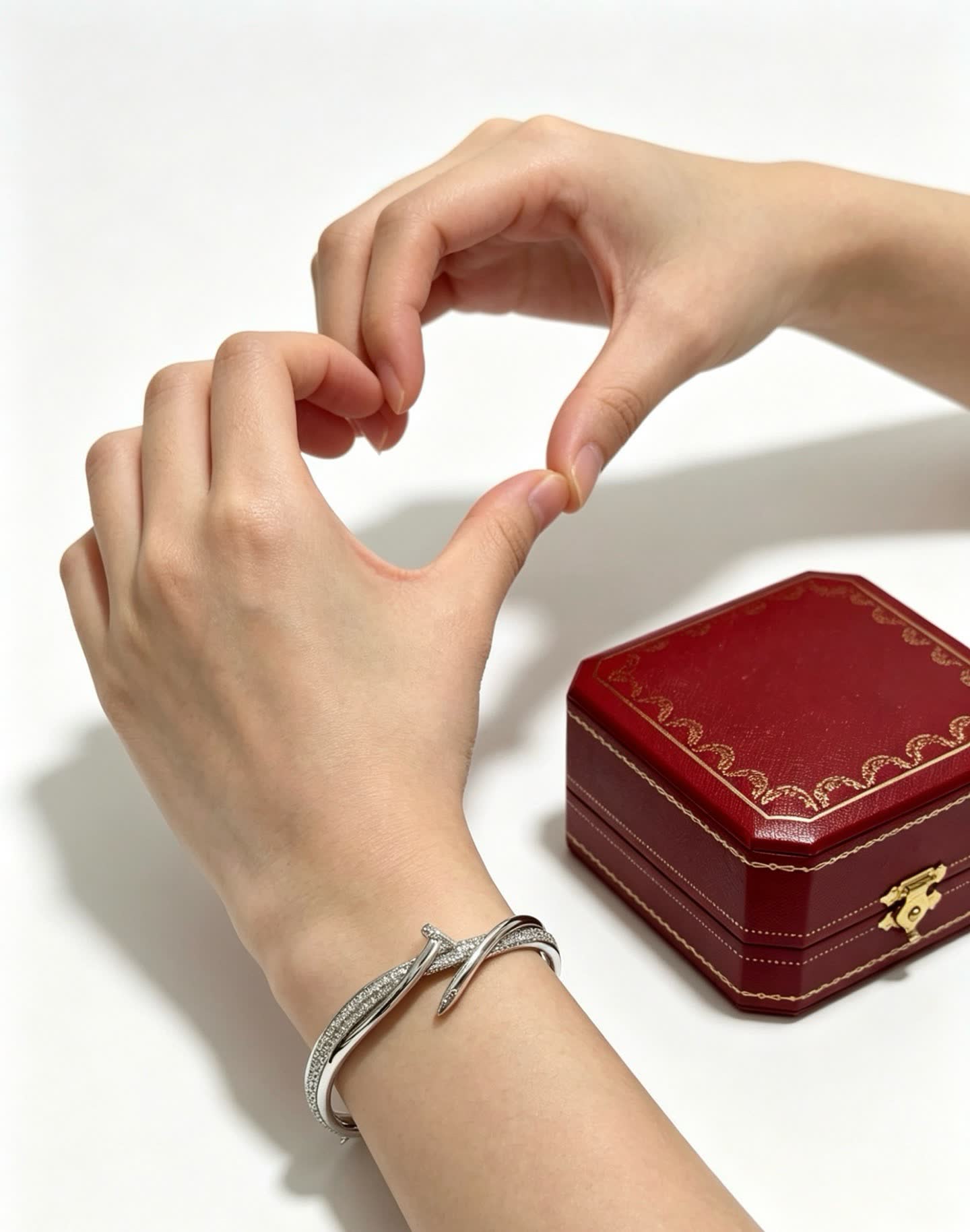 Cartier Elegant Silver Bangle Bracelet with Diamond Accents