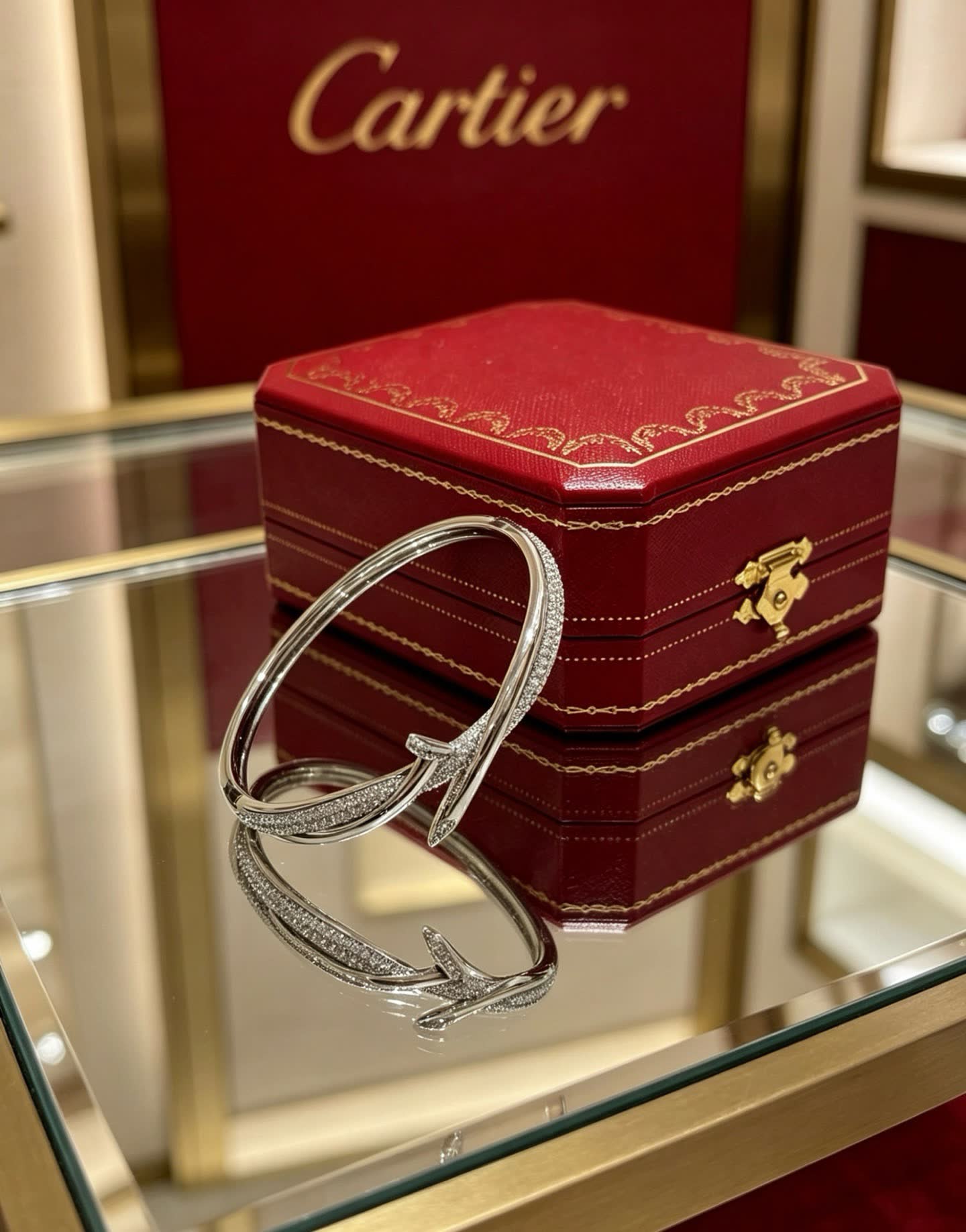 Cartier Elegant Silver Bangle Bracelet with Diamond Accents