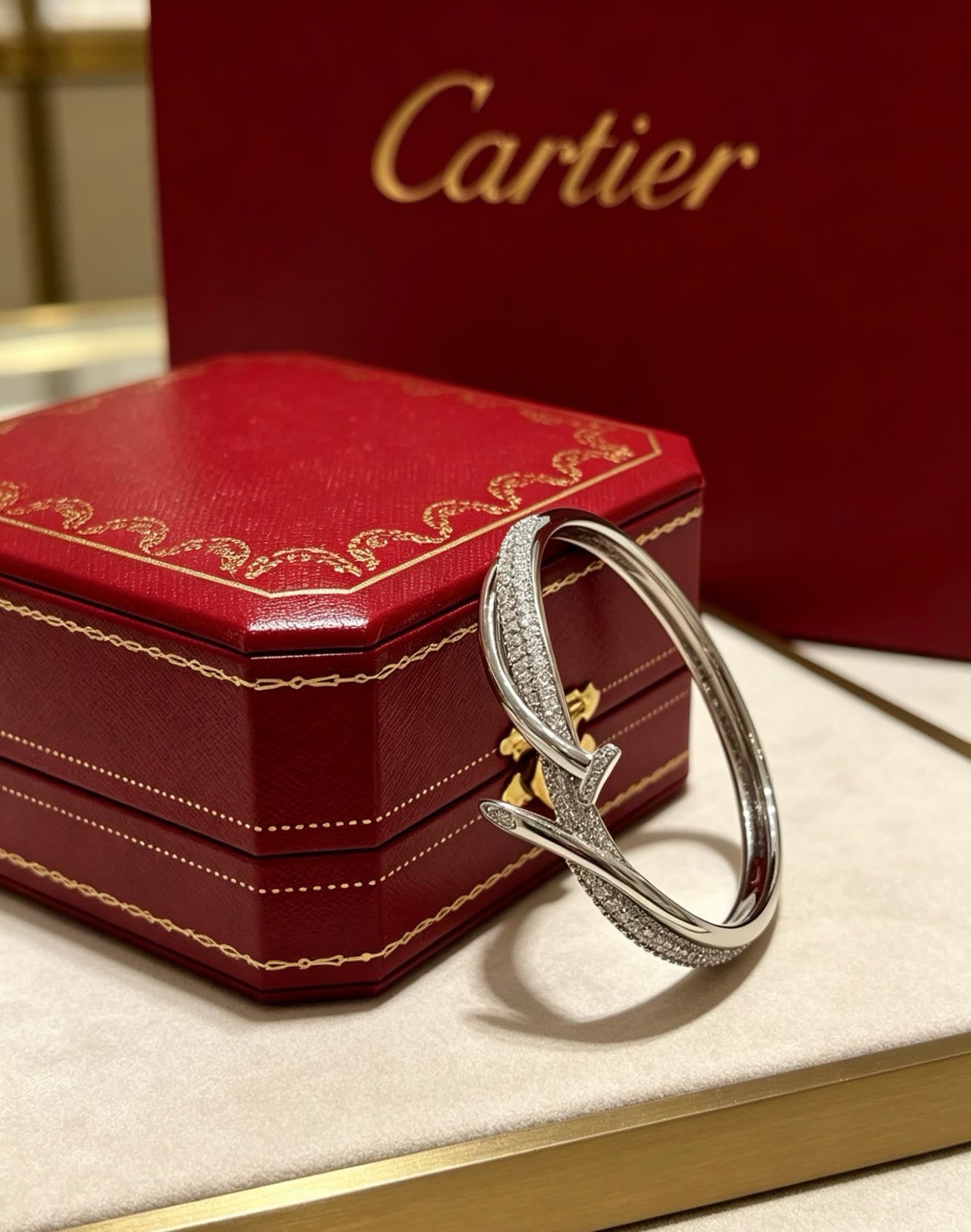 Cartier Elegant Silver Bangle Bracelet with Diamond Accents