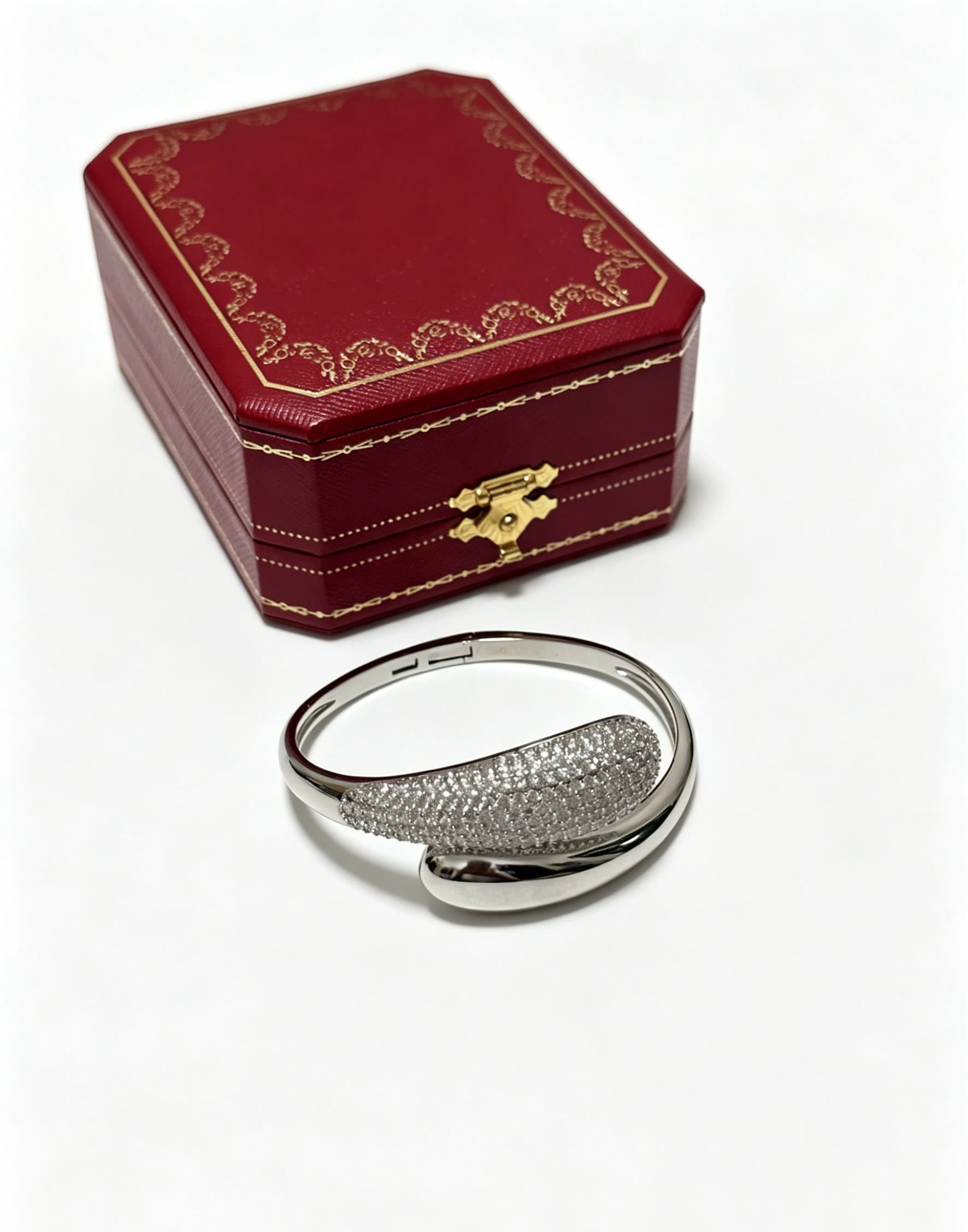 Cartier Elegant Silver Bangle Bracelet with Diamond Accents Cartier Elegant Silver Bangle Bracelet with Diamond Accents