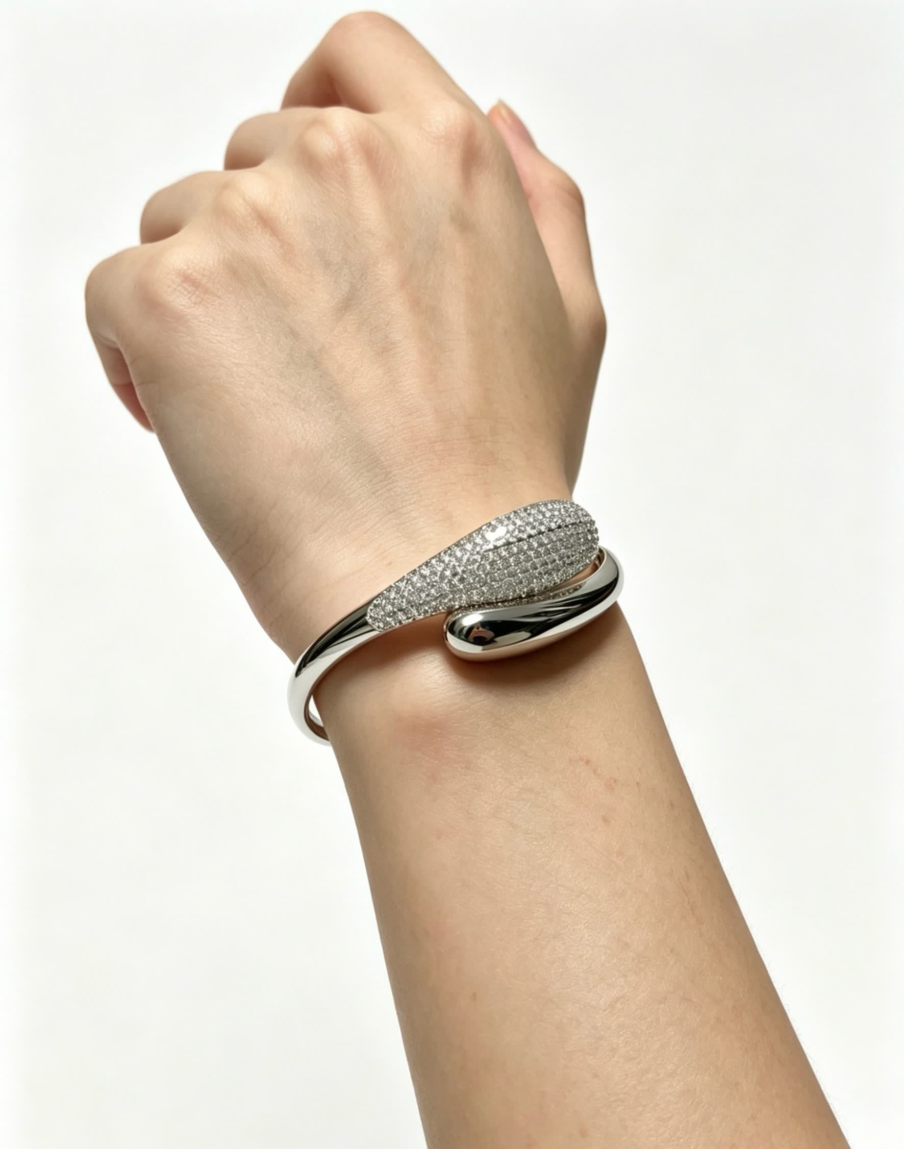 Cartier Elegant Silver Bangle Bracelet with Diamond Accents