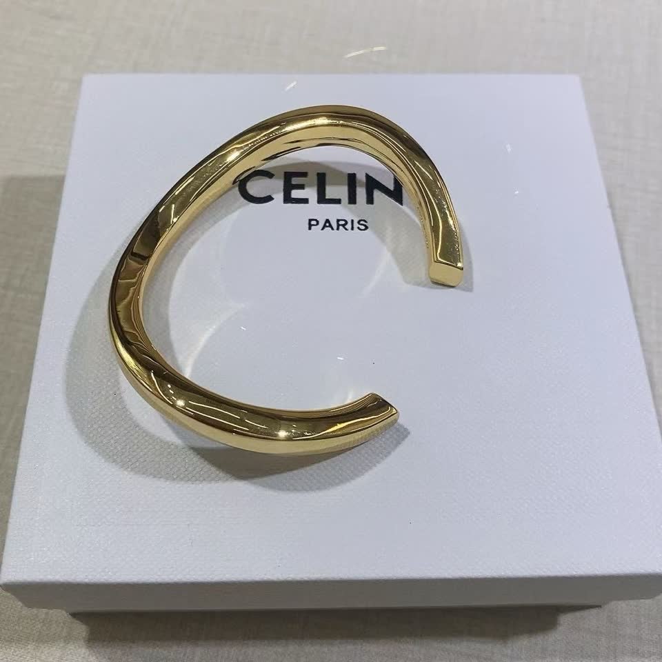 Celine Paris Gold Tone Bangle Bracelet