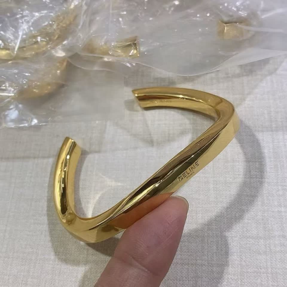 Celine Paris Gold Tone Bangle Bracelet