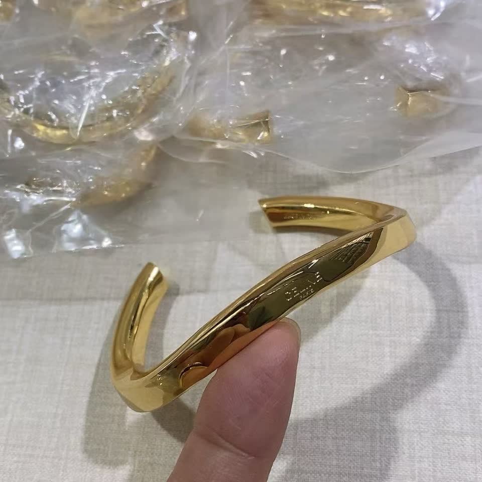 Celine Paris Gold Tone Bangle Bracelet