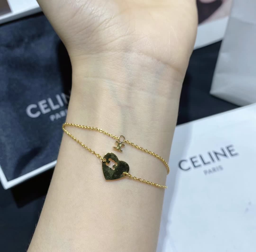 Celine Paris Gold Tone Heart Charm Bracelet