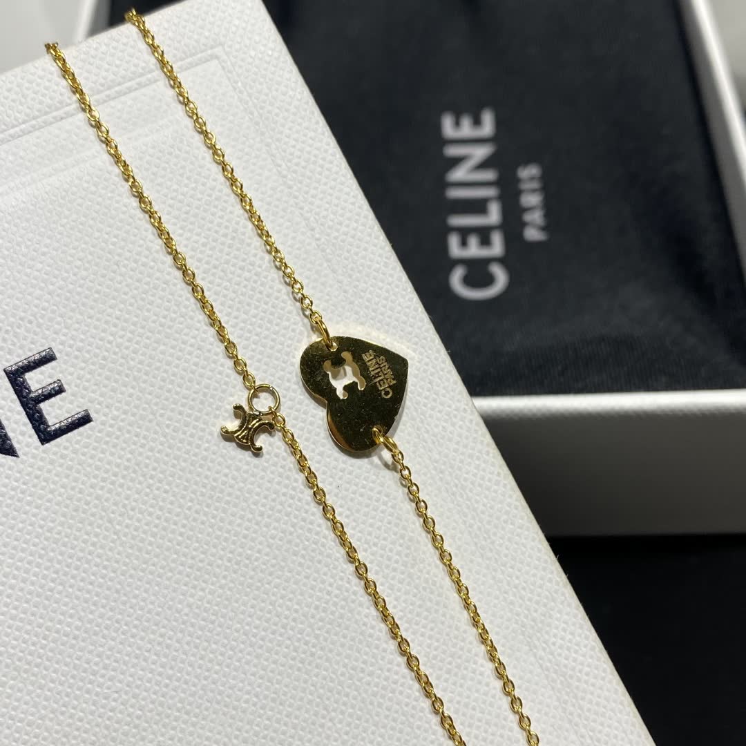 Celine Paris Gold Tone Heart Charm Bracelet