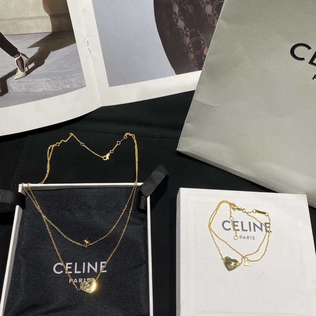 Celine Paris Gold Tone Heart Charm Bracelet