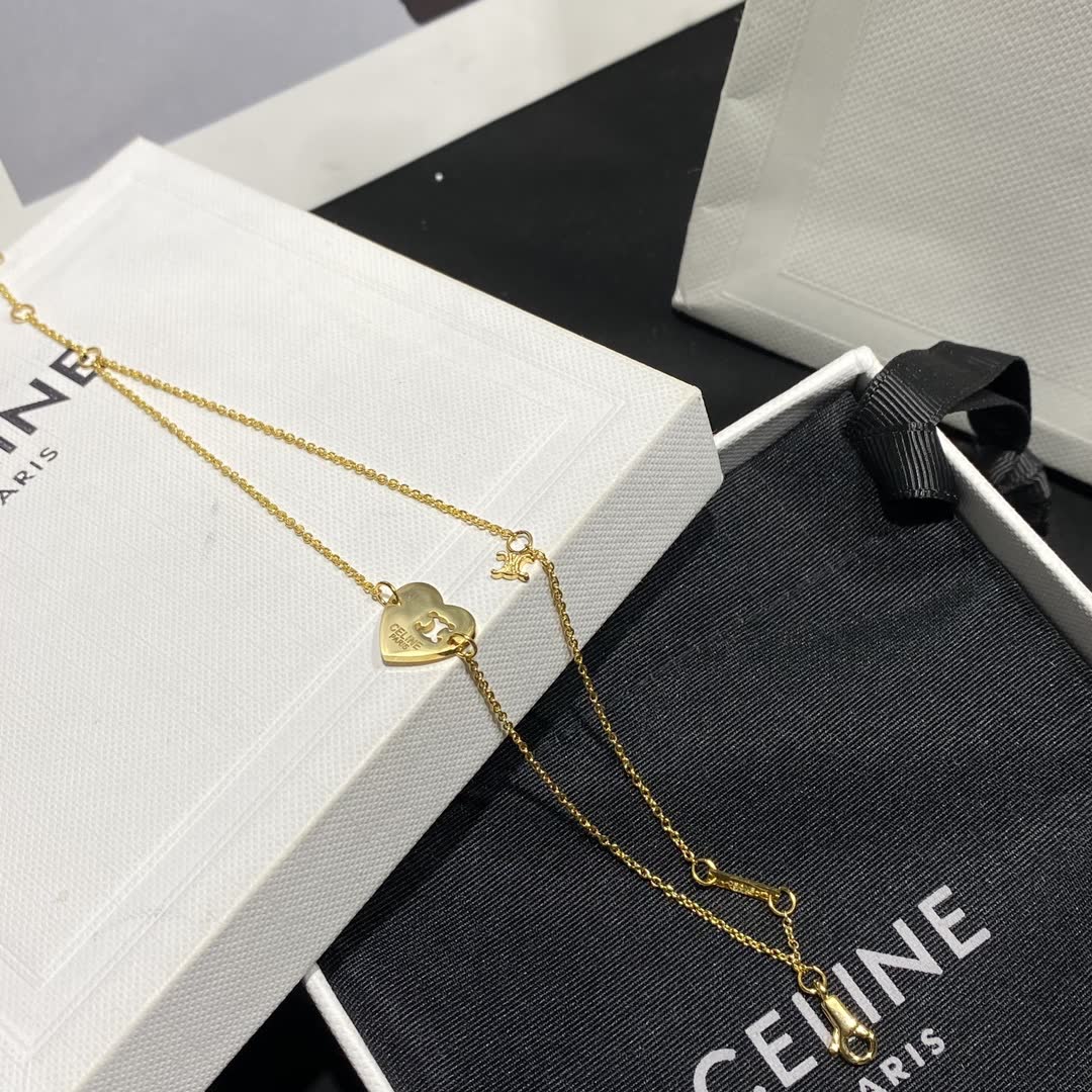 Celine Paris Gold Tone Heart Charm Bracelet