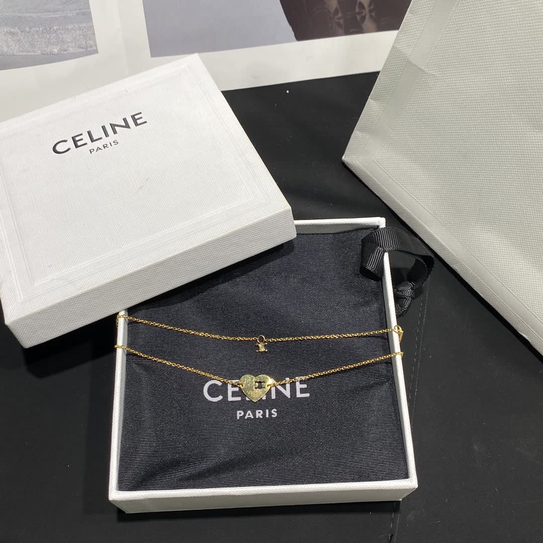Celine Paris Gold Tone Heart Charm Bracelet