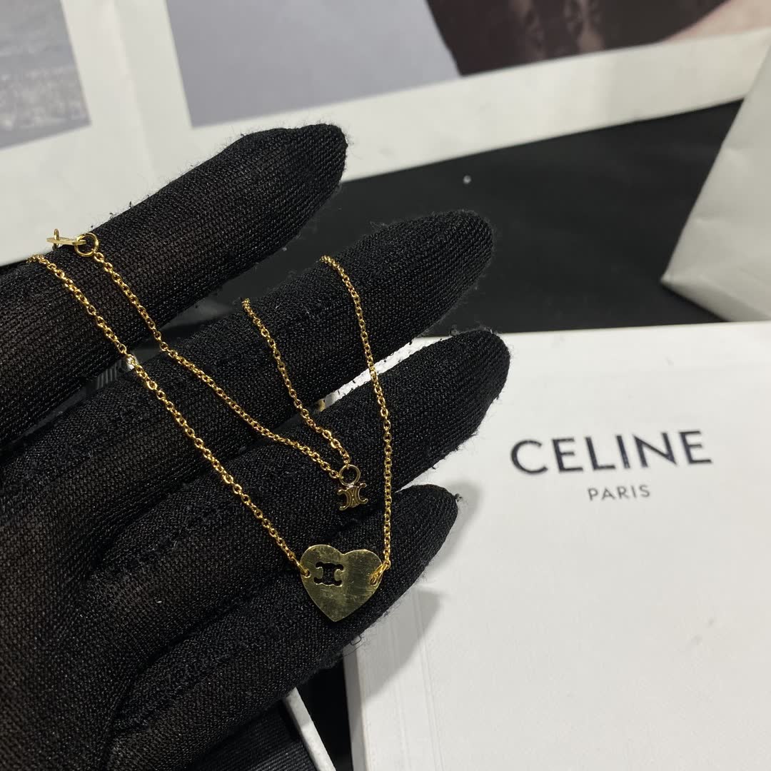 Celine Paris Gold Tone Heart Charm Bracelet
