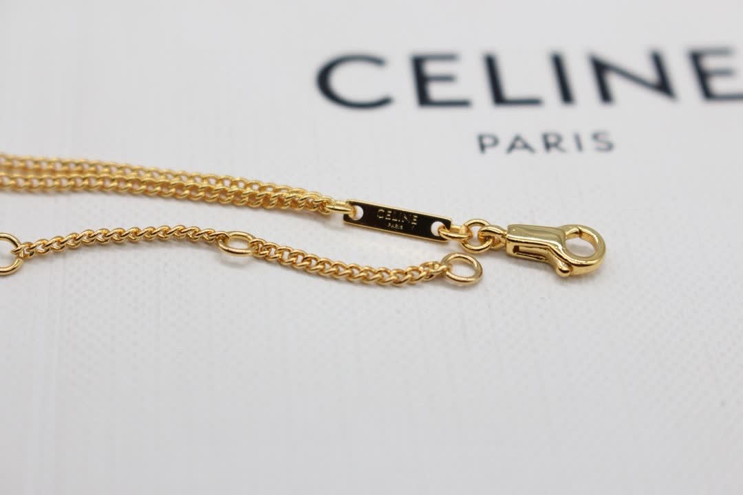 Celine Paris Gold Tone Heart Bracelet