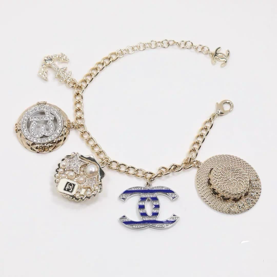 Chanel Gold Tone Charm Bracelet with Crystal and Pearl Accents
