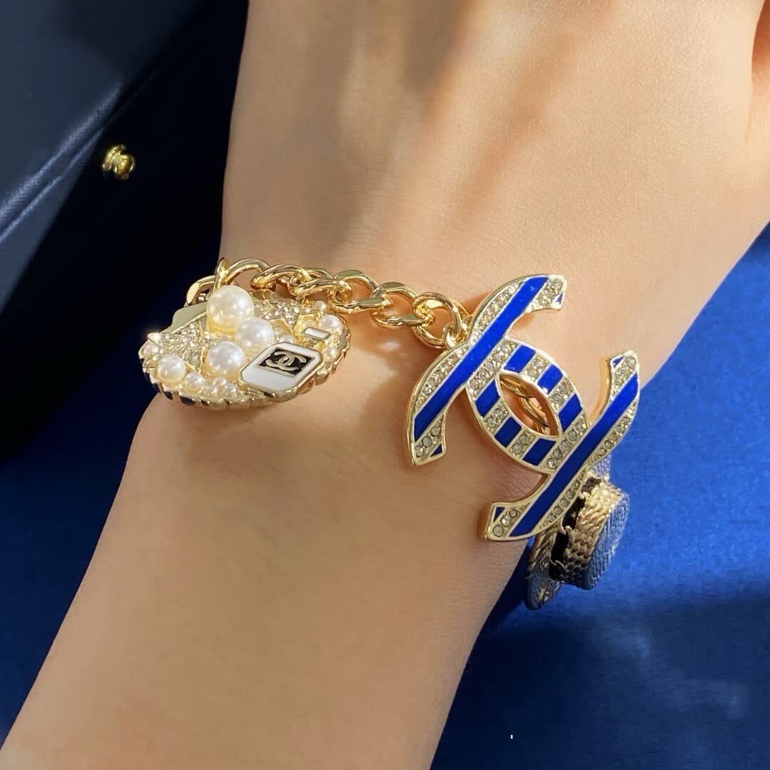 Chanel Gold Tone Charm Bracelet with Crystal and Pearl Accents