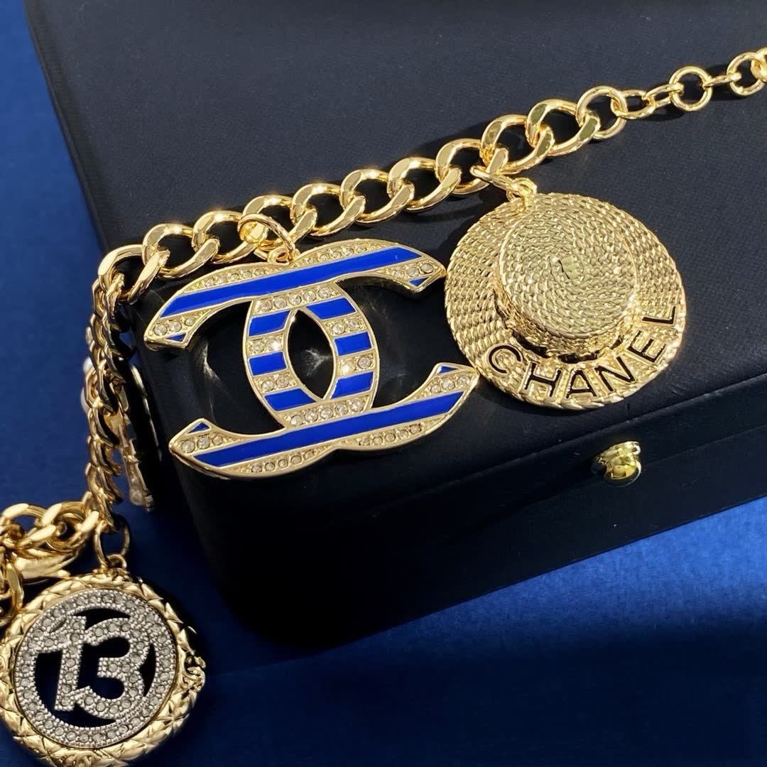 Chanel Gold Tone Charm Bracelet with Crystal and Pearl Accents